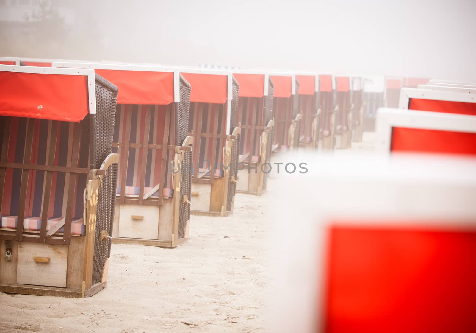 Strandkorb, Strandkoerbe in Rugen, Germany, Beach chairs on the sandy beach in Binz