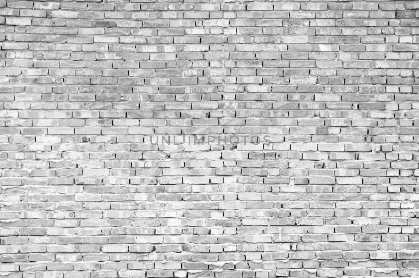 Textured old brick wall background,monochrome