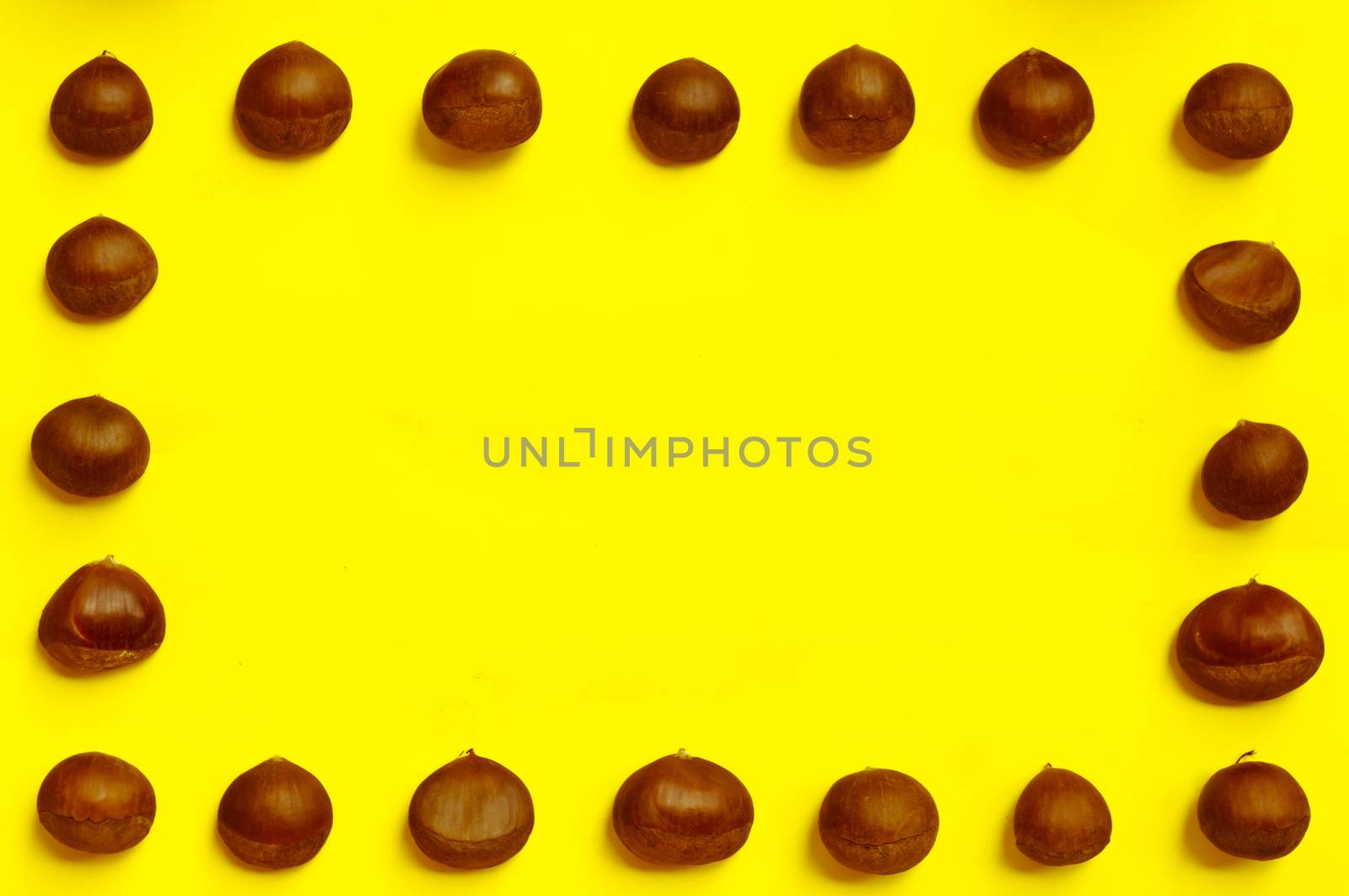 Chestnuts pattern on yellow background, top view, chestnut, castanea