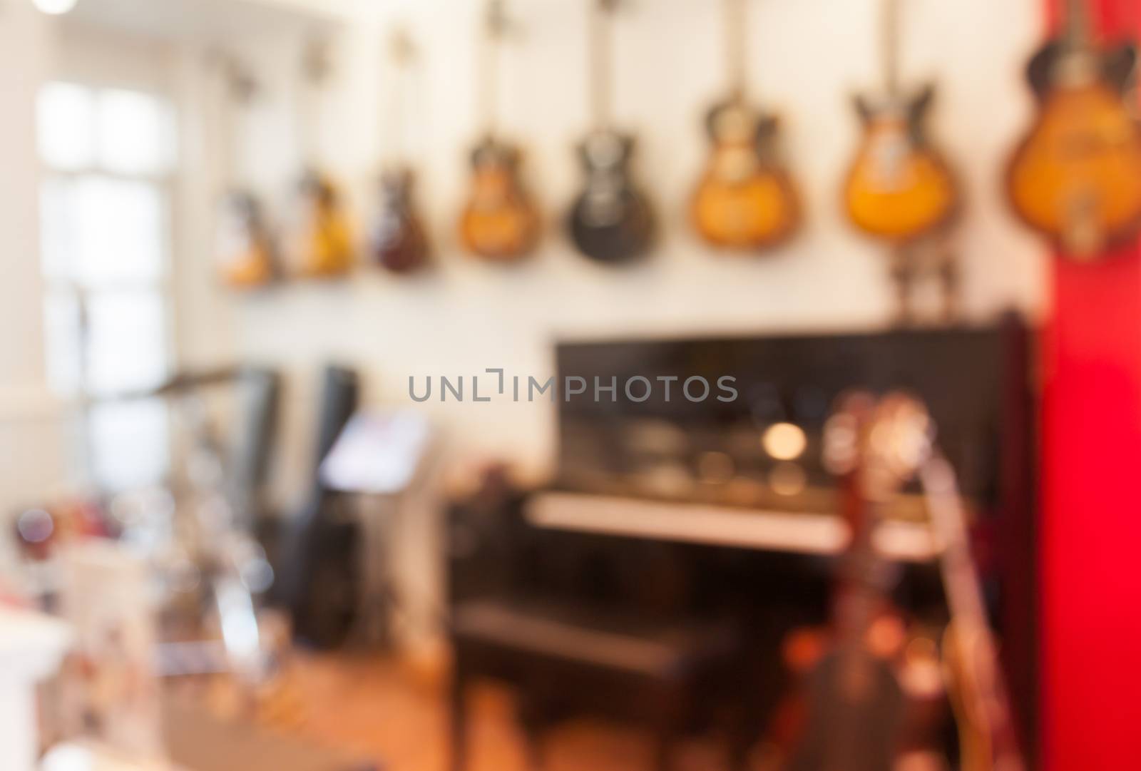 Blur abstract background with instrumentsin music store by punsayaporn