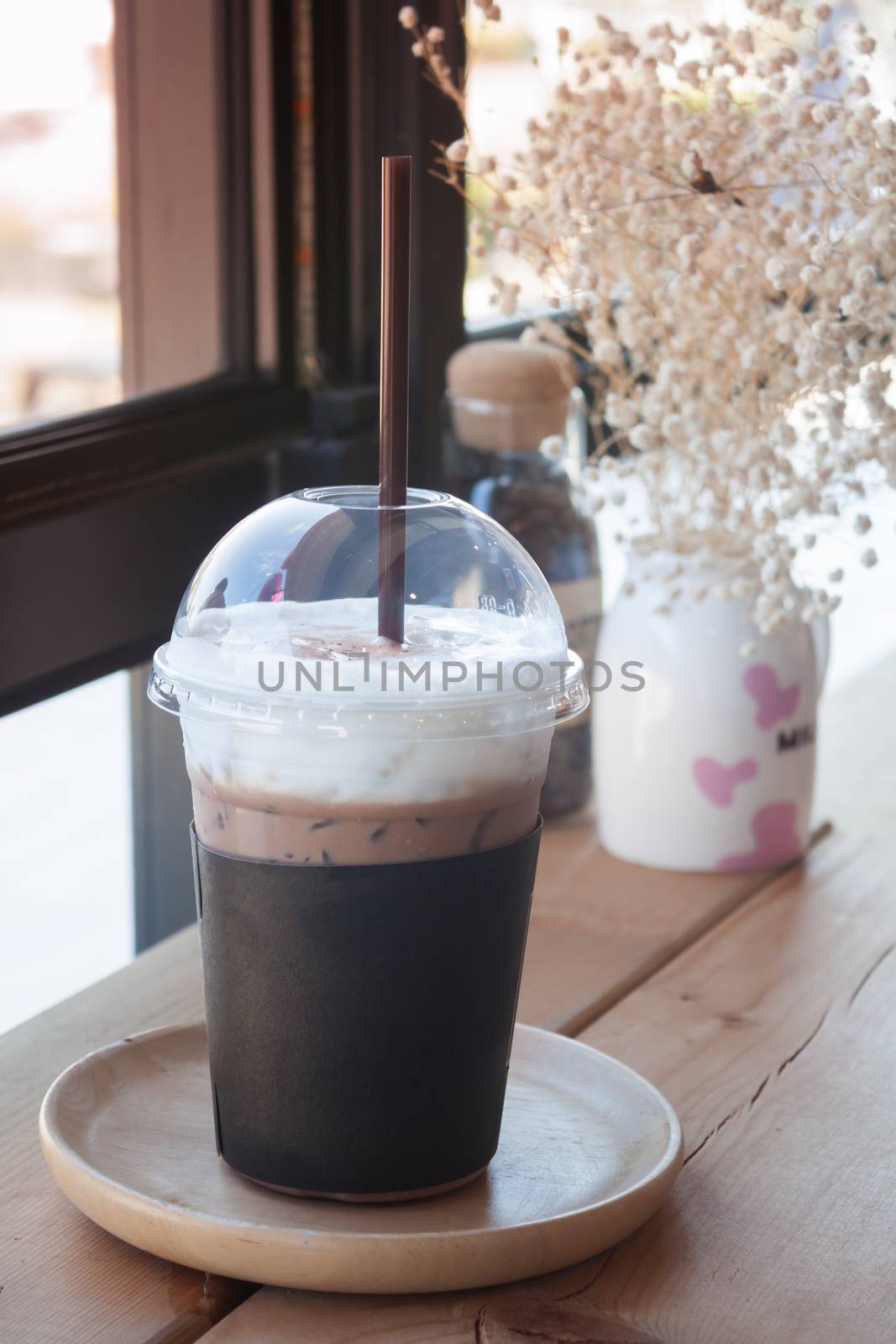 Iced coffee in coffee shop by punsayaporn