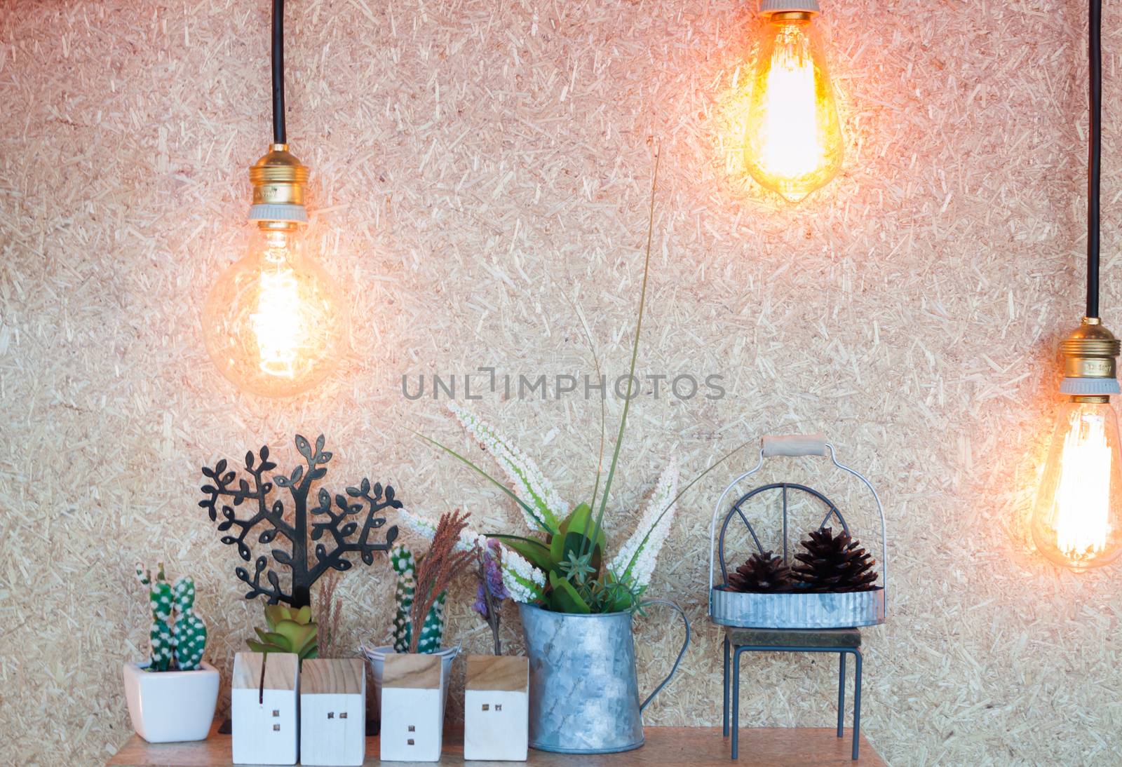 Vintage lighting decorated on brown background, stock photo