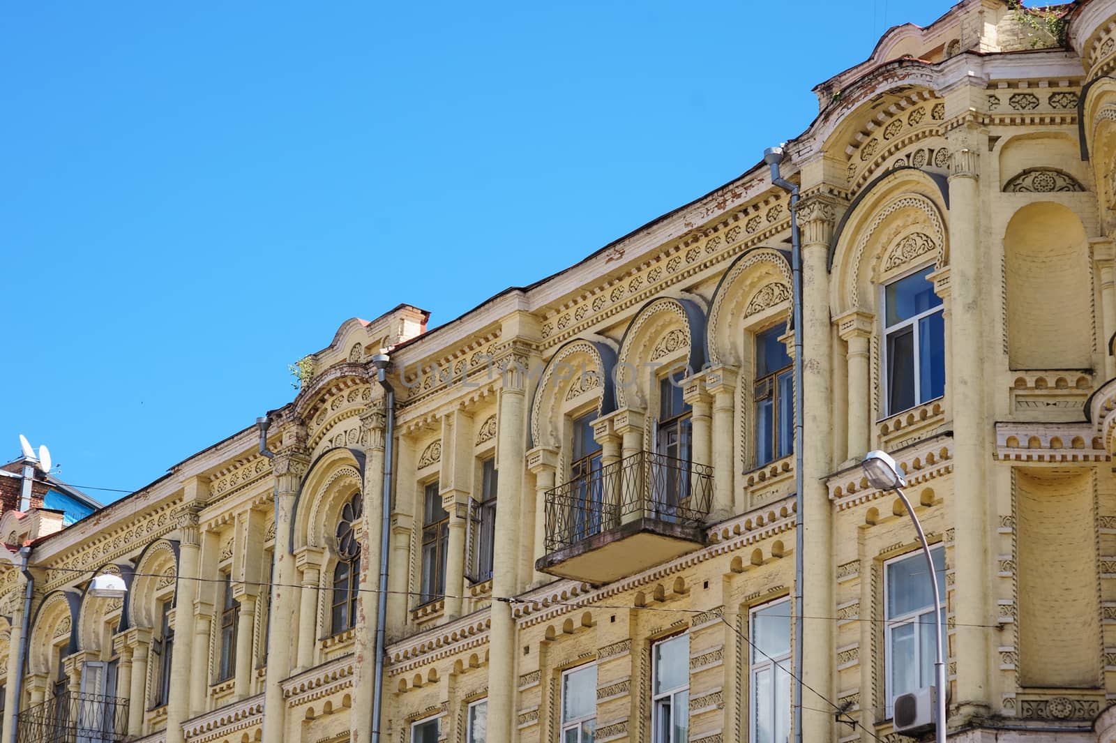 multi-story historic building with windows in city