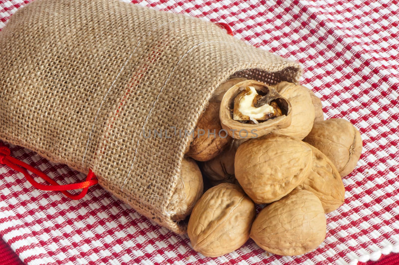 some nuts over a white and red placemat