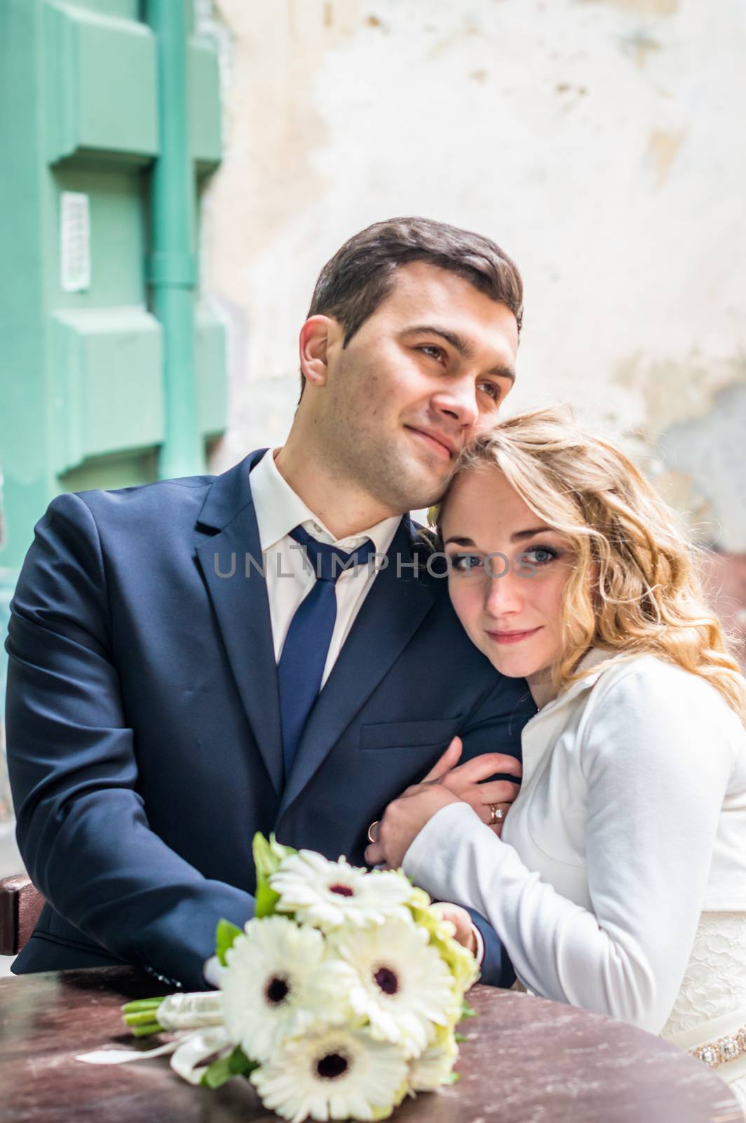 newlyweds sitting in the Cafe at the table