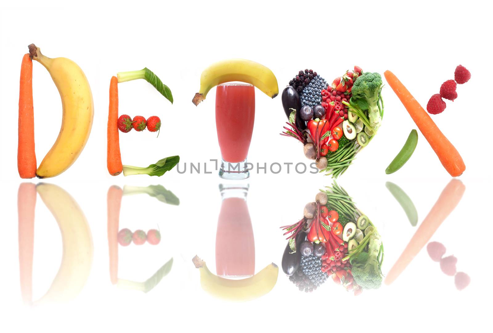 Detox text letters including fruit, vegetables and a smoothie beverage and heartshape in the middle 