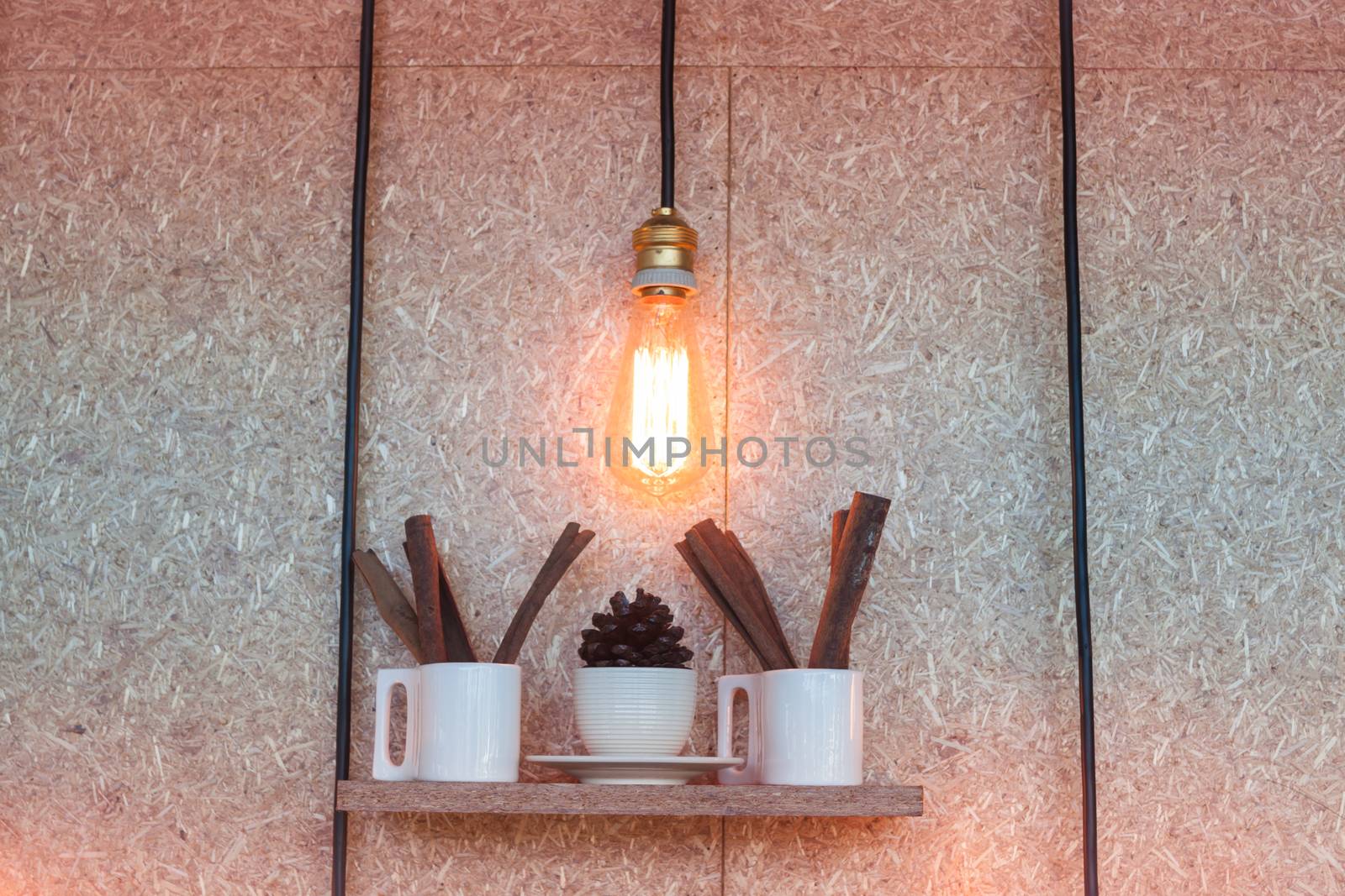 Vintage lighting decorated on brown background by punsayaporn