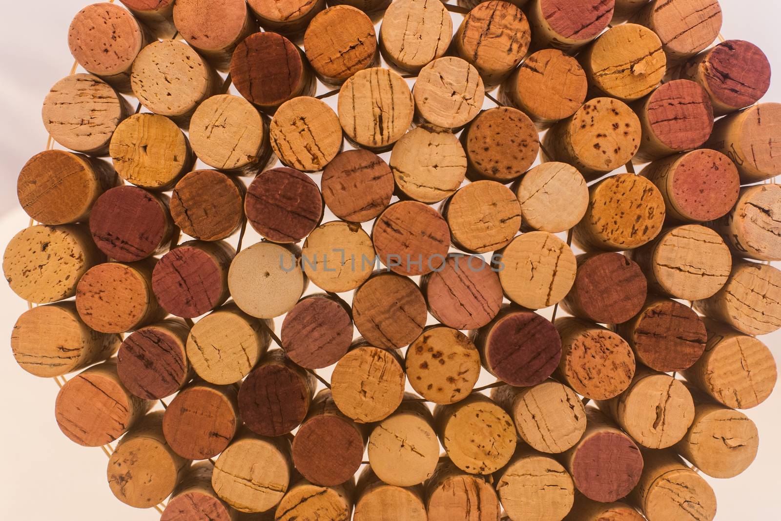 Stack of used wine corks by johnborda