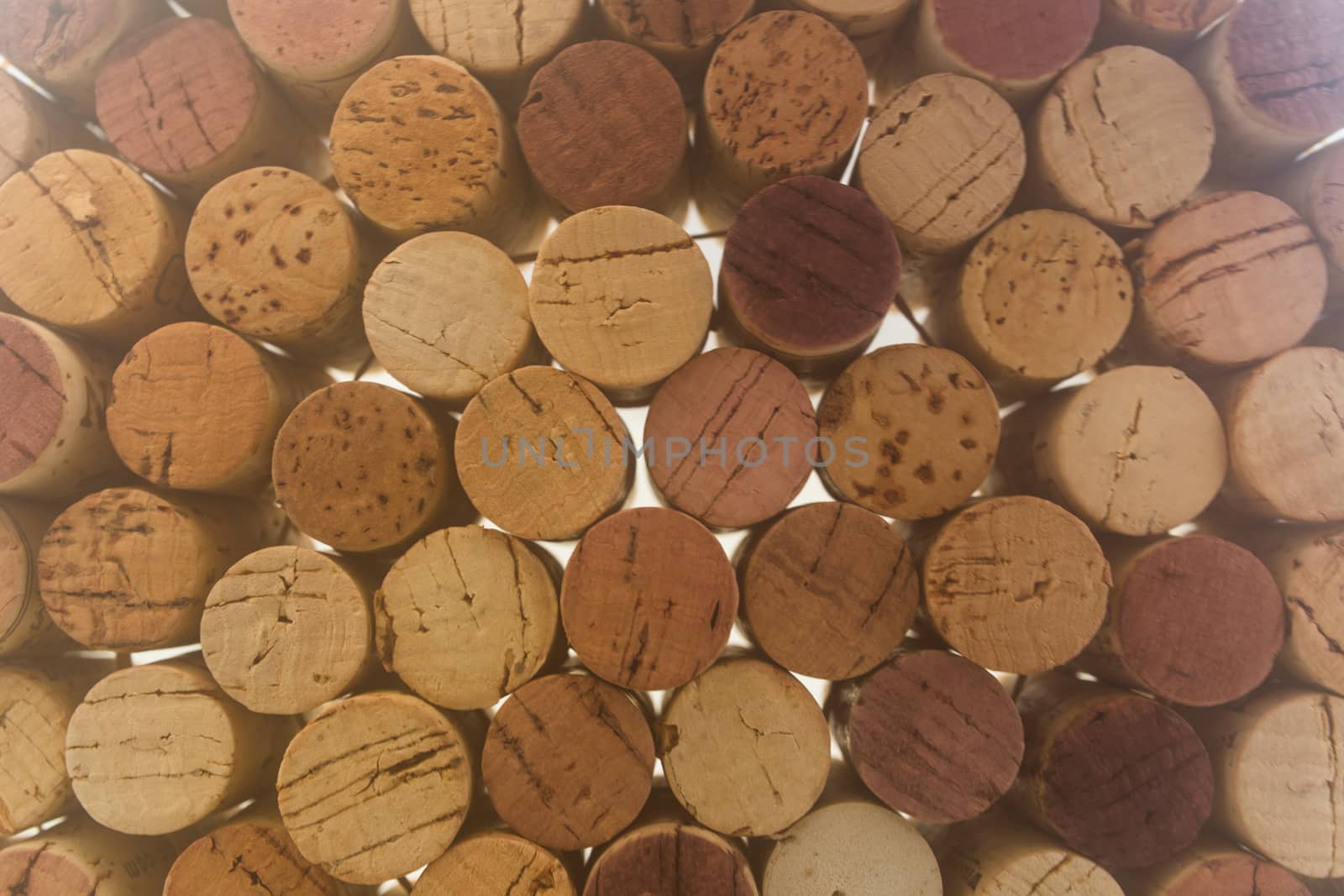 Stack of used wine corks by johnborda