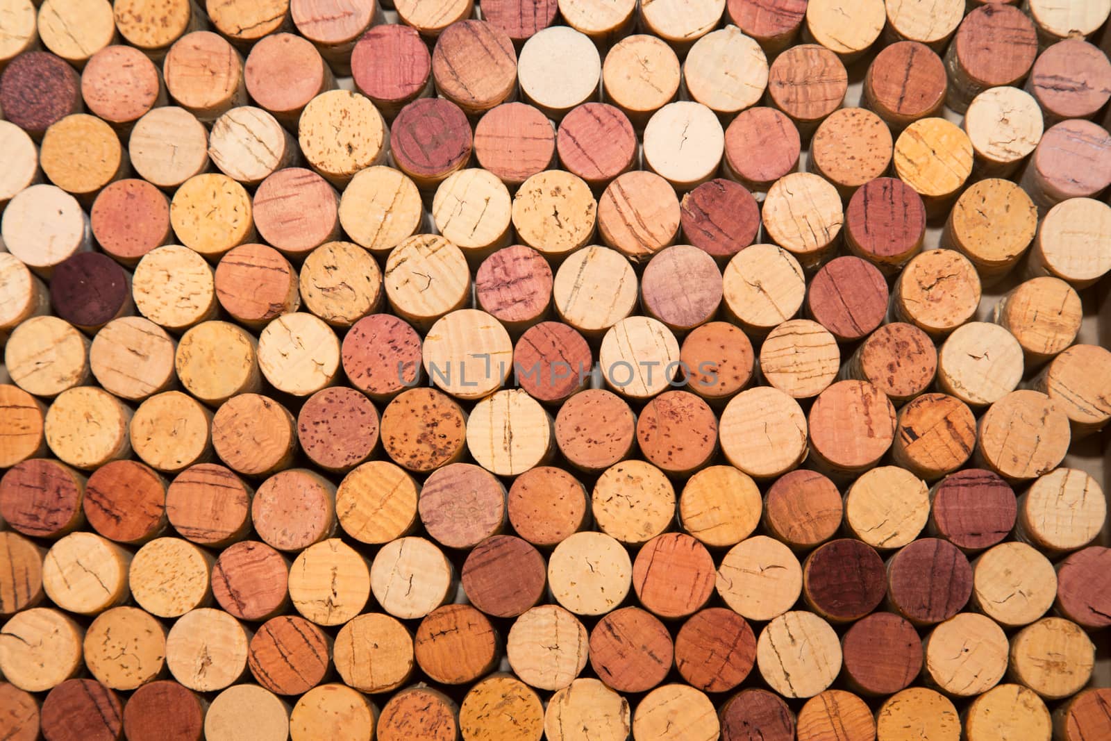 Stack of used wine corks by johnborda