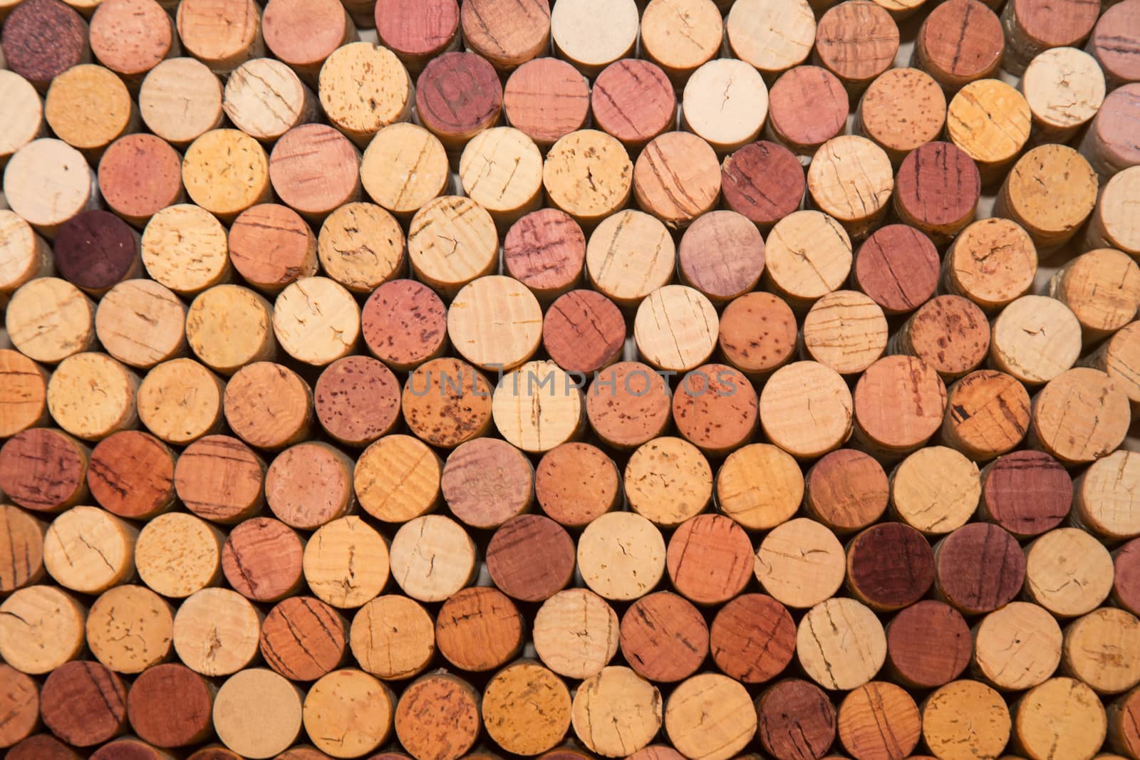 Stack of used wine corks by johnborda