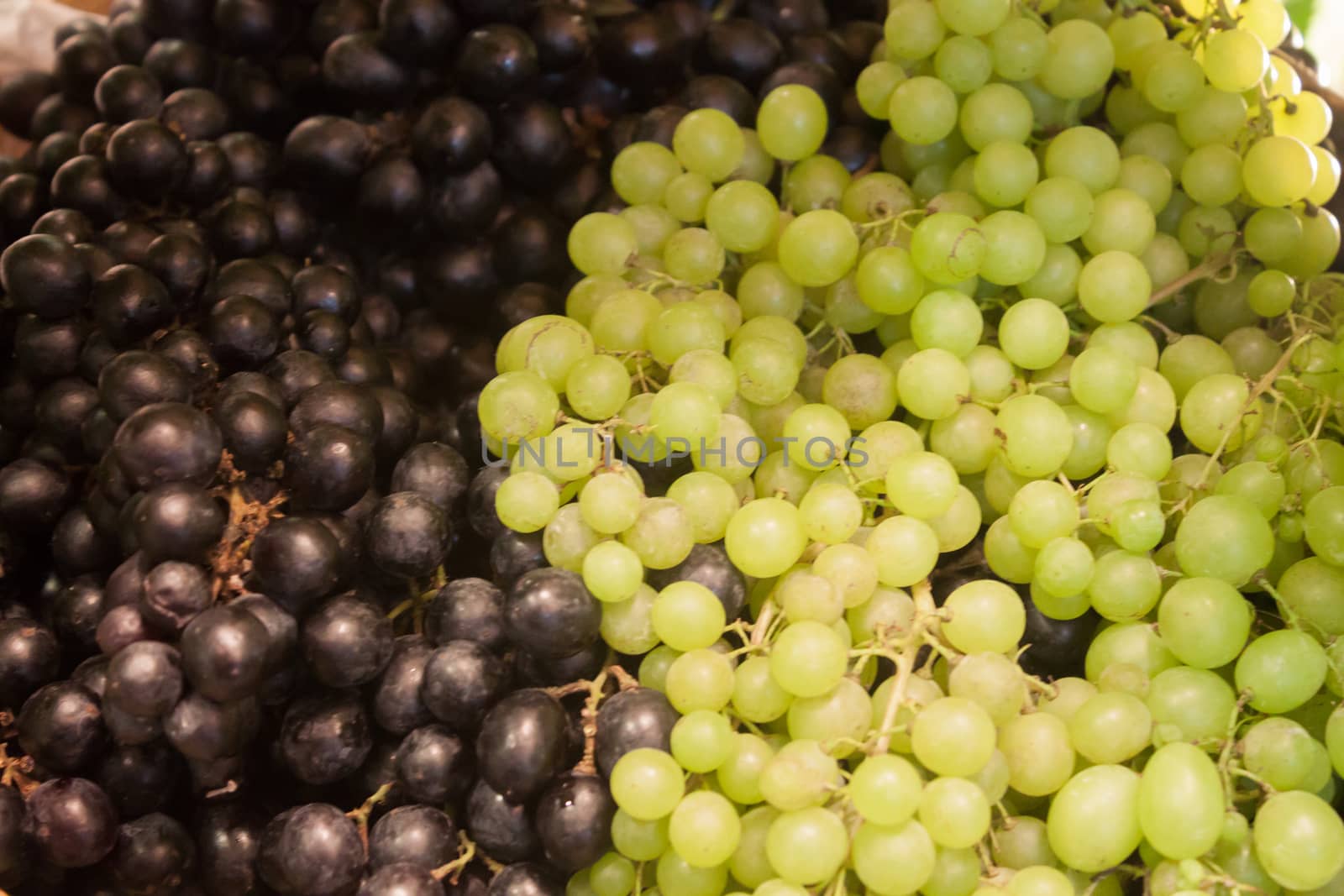 Background of blue and green grapes by punsayaporn