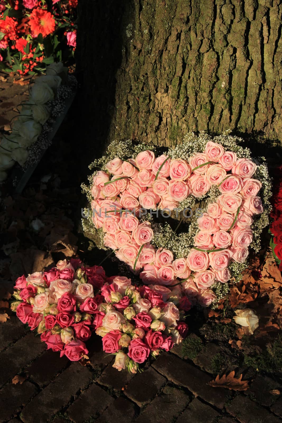 Heart shaped sympathy flowers by studioportosabbia