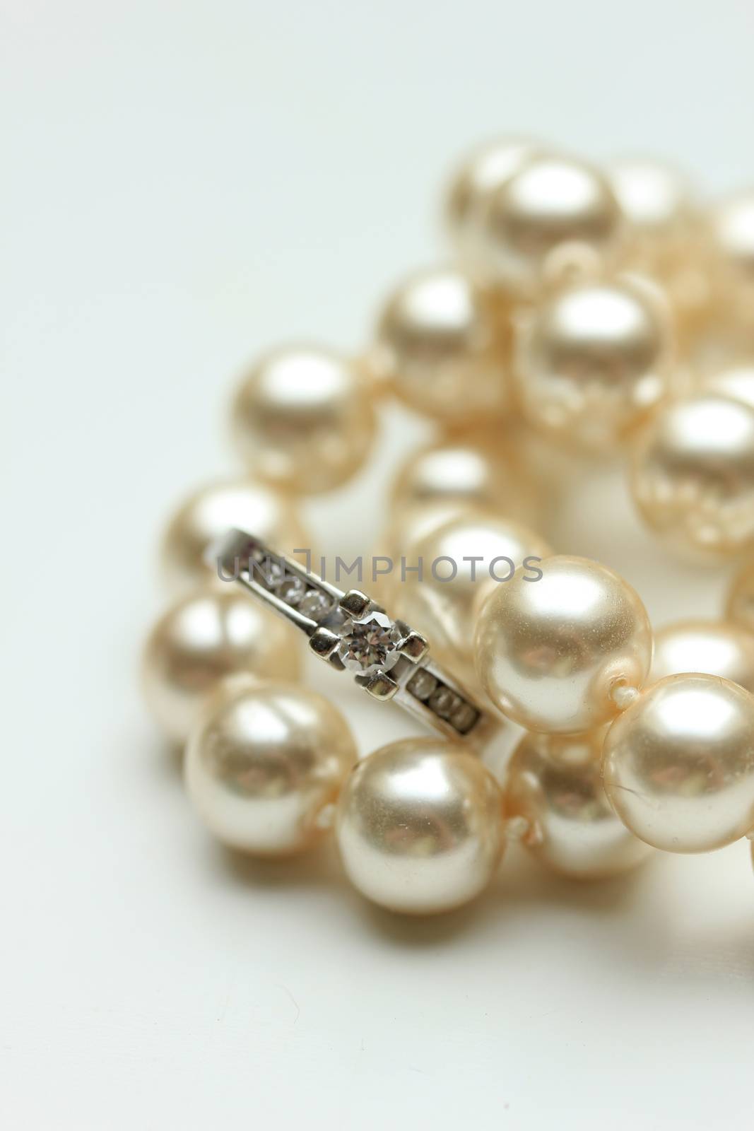 Engagement ring on pearls by studioportosabbia