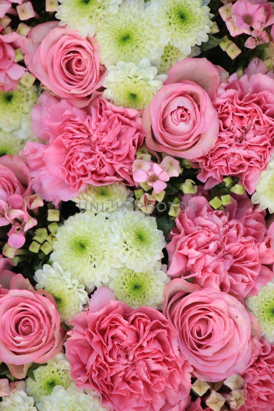 Mixed pink flowers in a floral wedding decoration