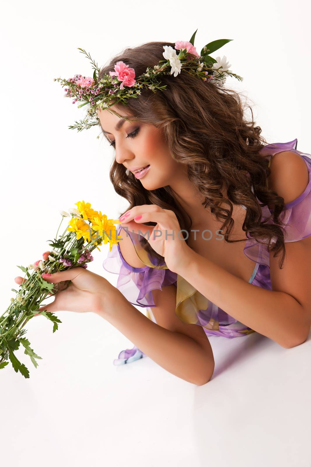 Young woman with flowers on isolated background