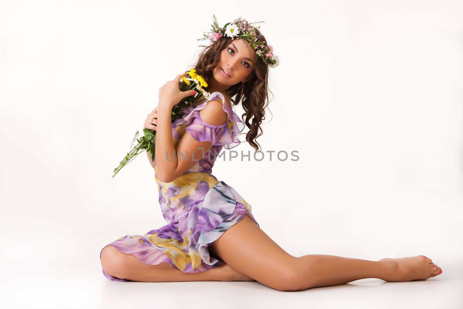 Young woman with flowers on isolated background