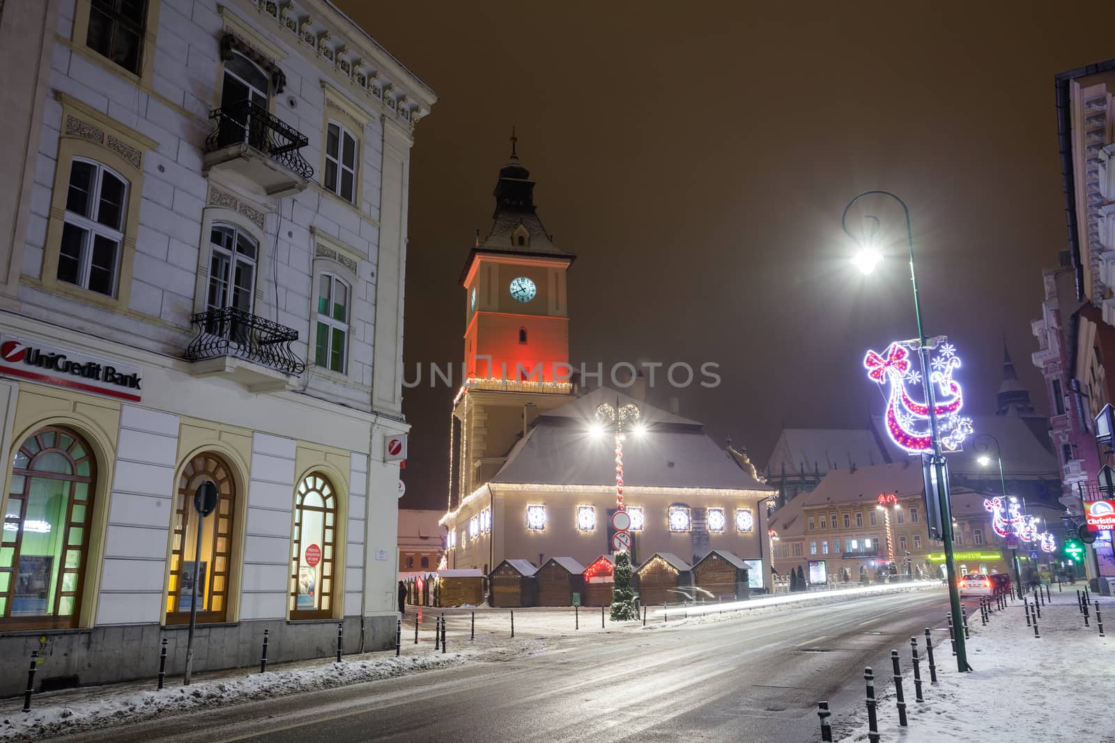 BRASOV, ROMANIA - 15 DECEMBER 2016: Brasov Council House night view decorated for Christmas and traditional winter market in the old town center, Romania