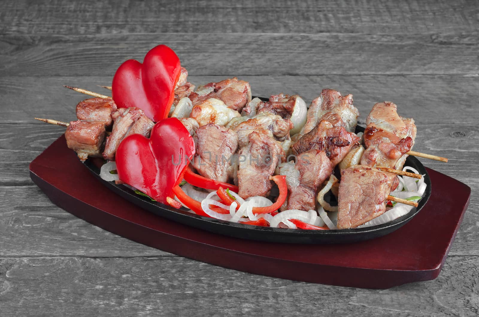 Pork kebab with salad of sweet peppers and onions by Gaina