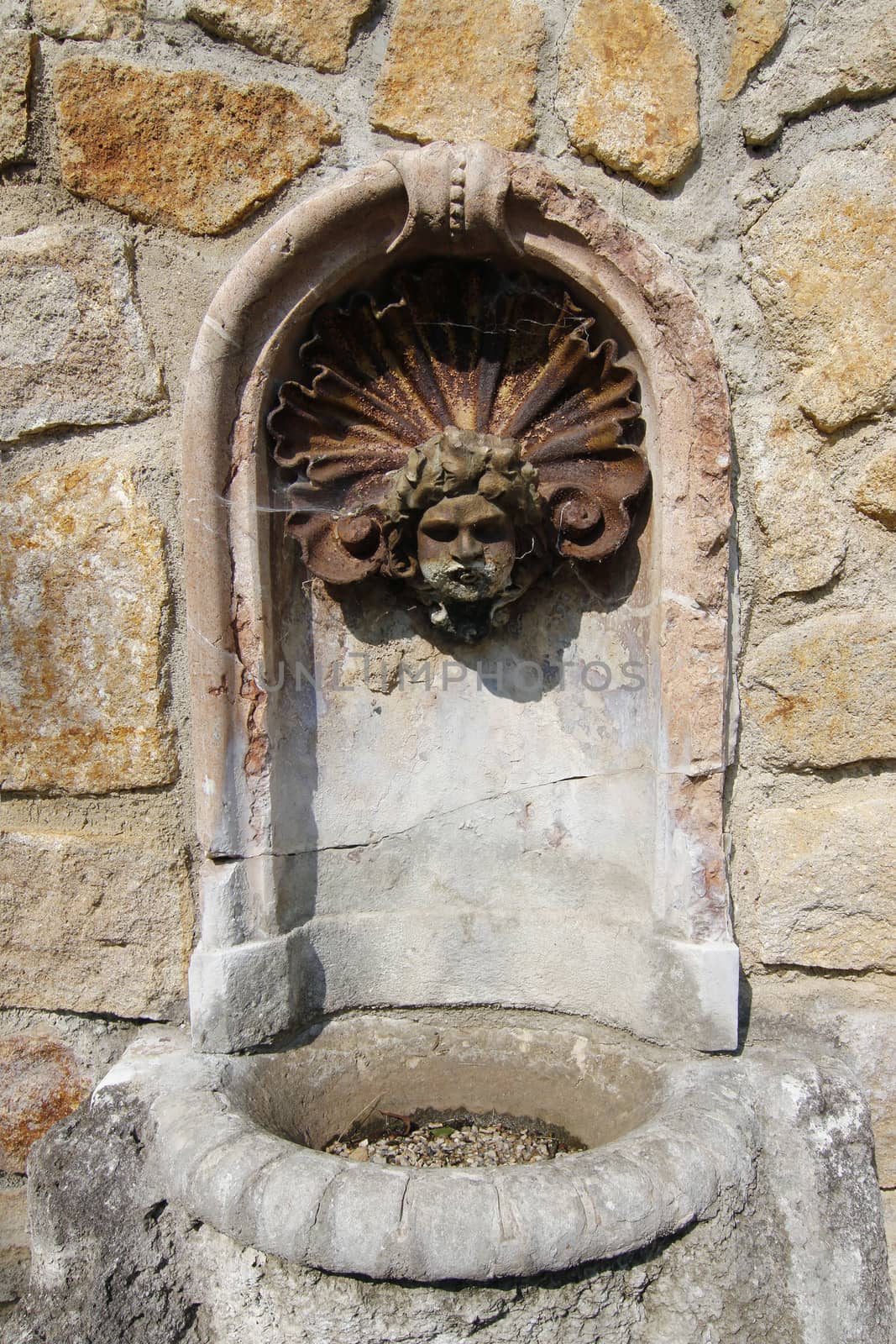 Detail of the old decorative drinking fountain