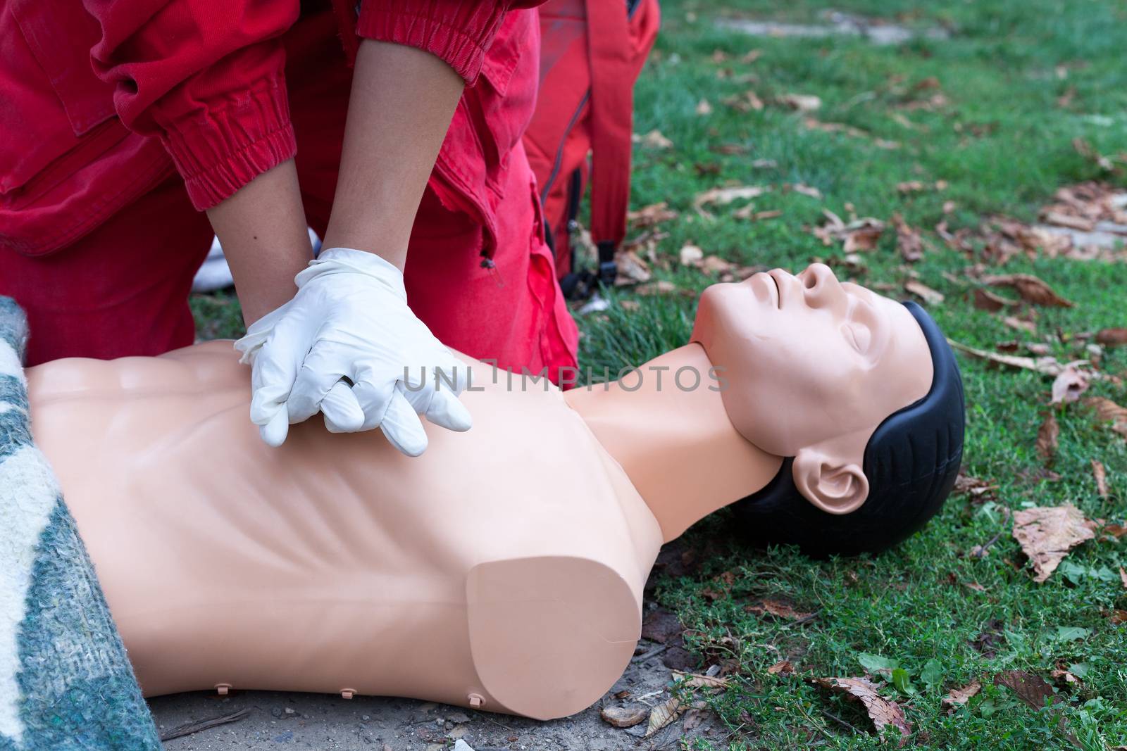Paramedic demonstrate Cardiopulmonary resuscitation - CPR on dummy by wellphoto