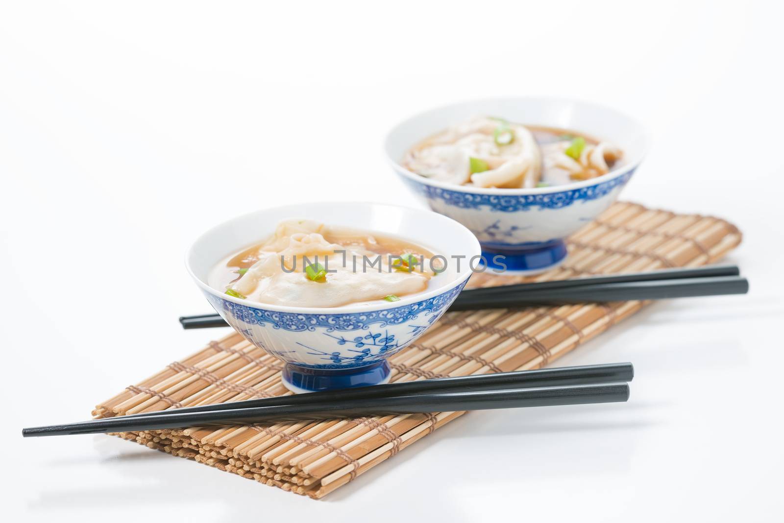 Two bowls of hot and delicious wonton soup.