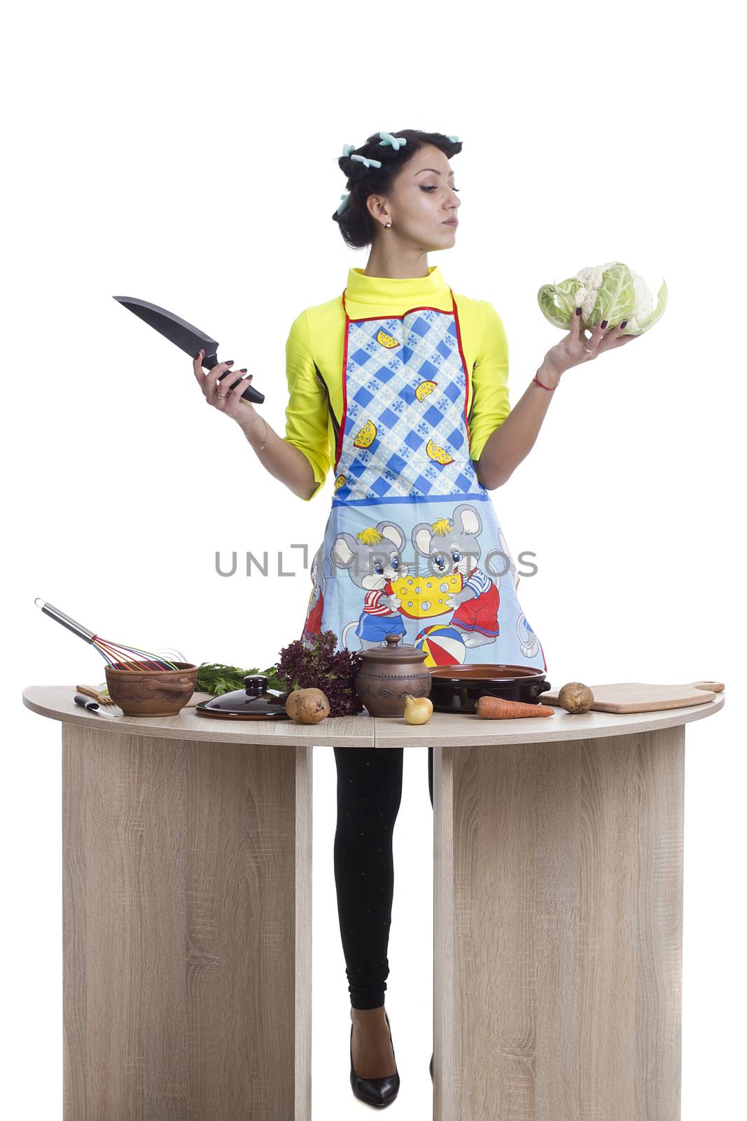 Beautiful woman preparing a meal on a white background