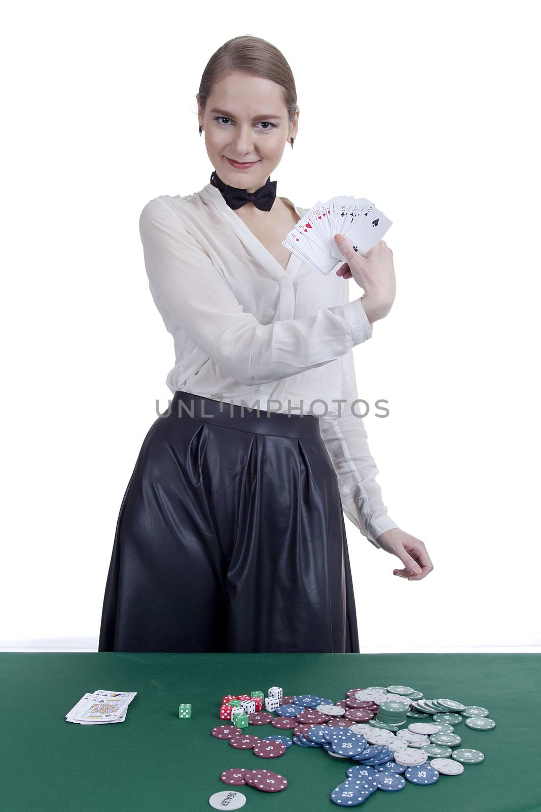 Beautiful young woman croupier on a white background