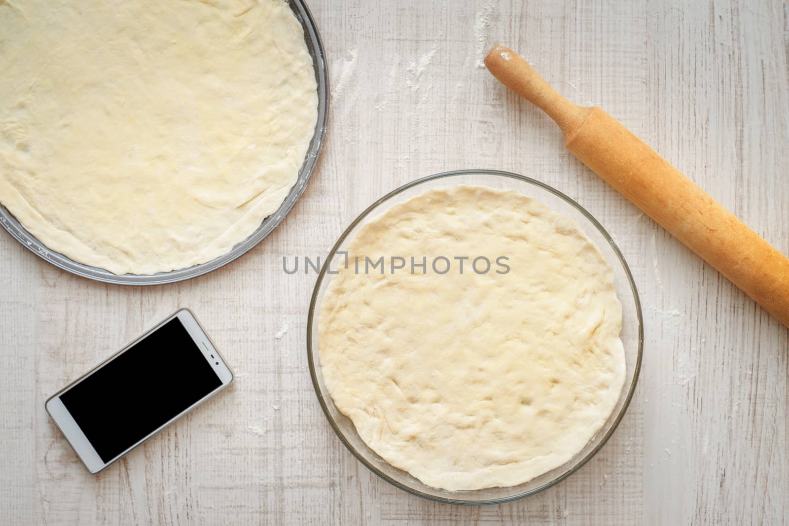 Ready dough for pizzas in forms for baking by Deniskarpenkov