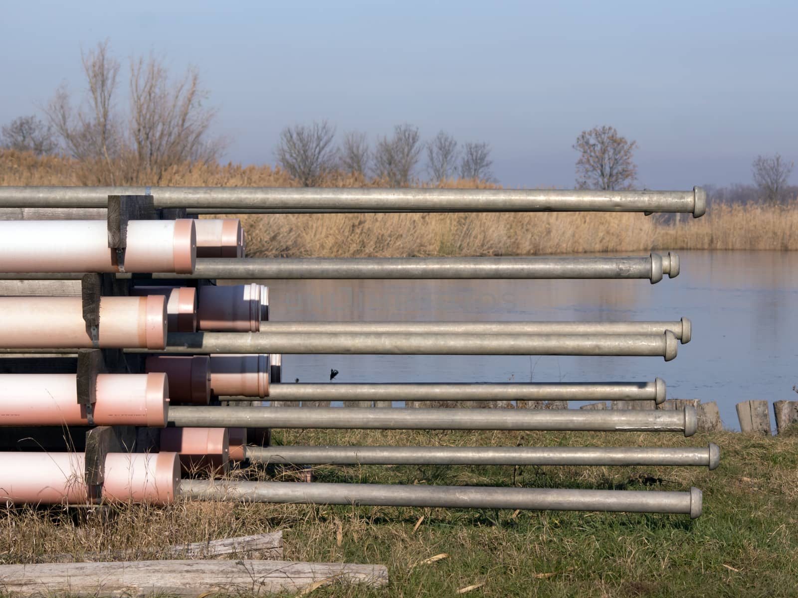 Irrigation aluminum metal tube on the lake shore.
