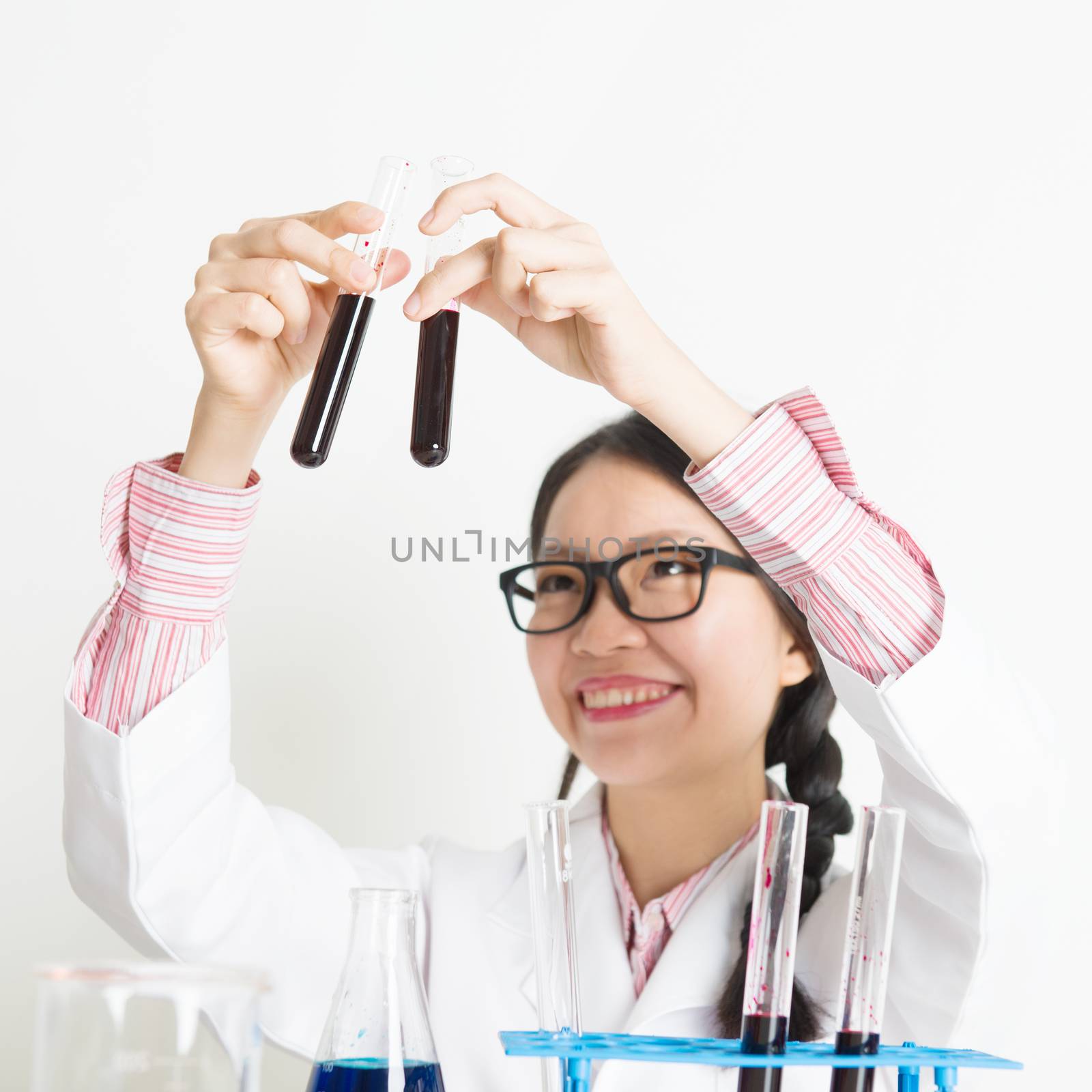Young female scientist carrying out scientific research  by szefei