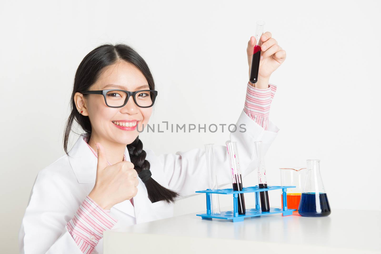 Asian female scientist in lab by szefei
