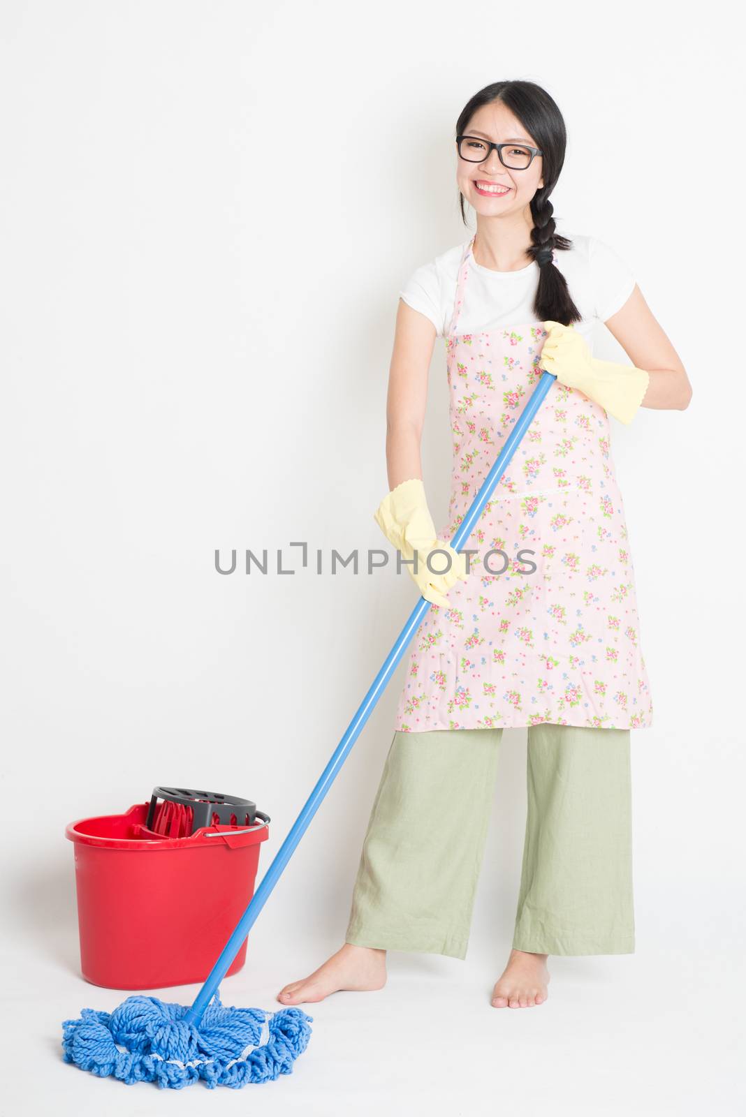 Young Woman Cleaning floor by szefei