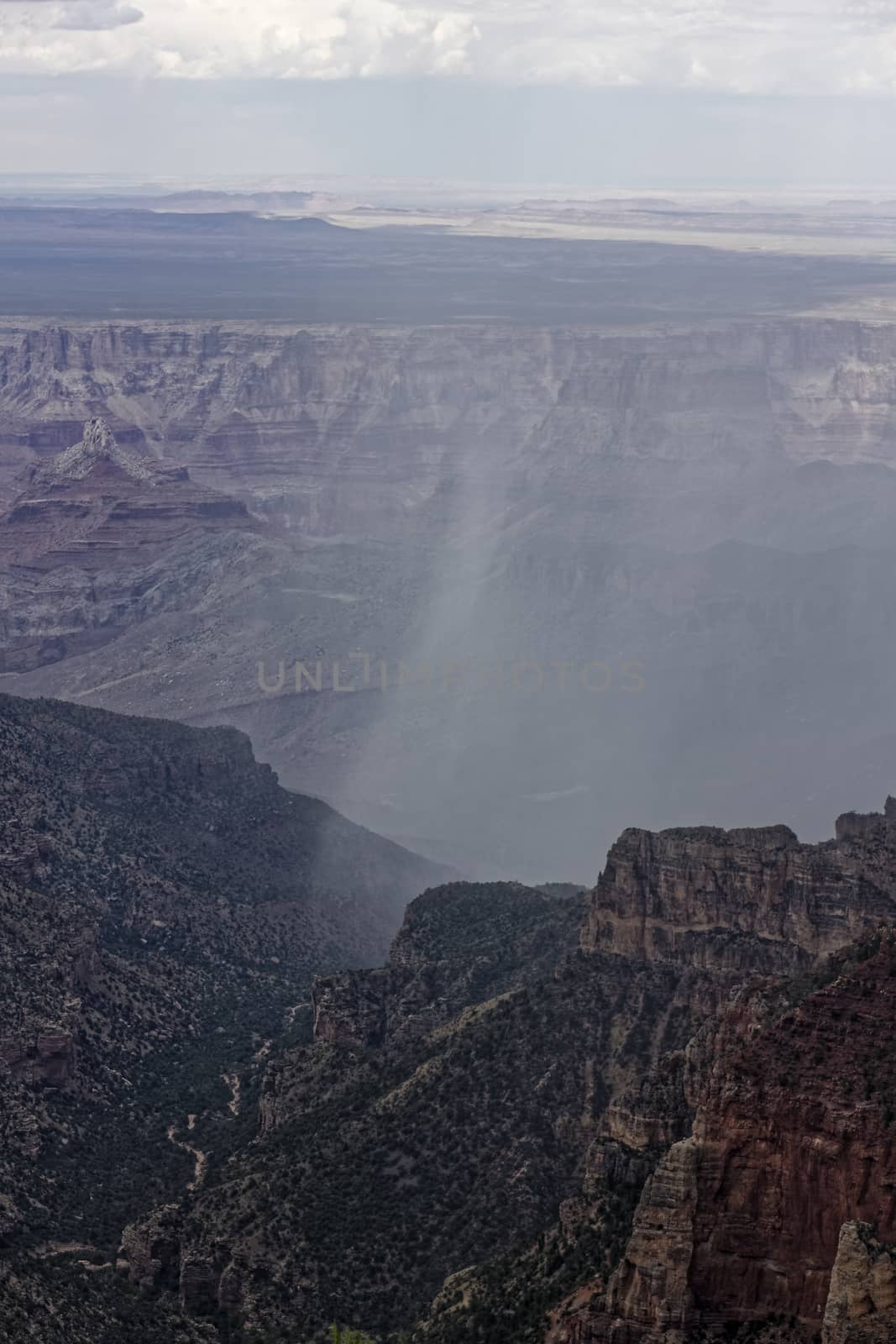 Rain pours through the Grand Canyon