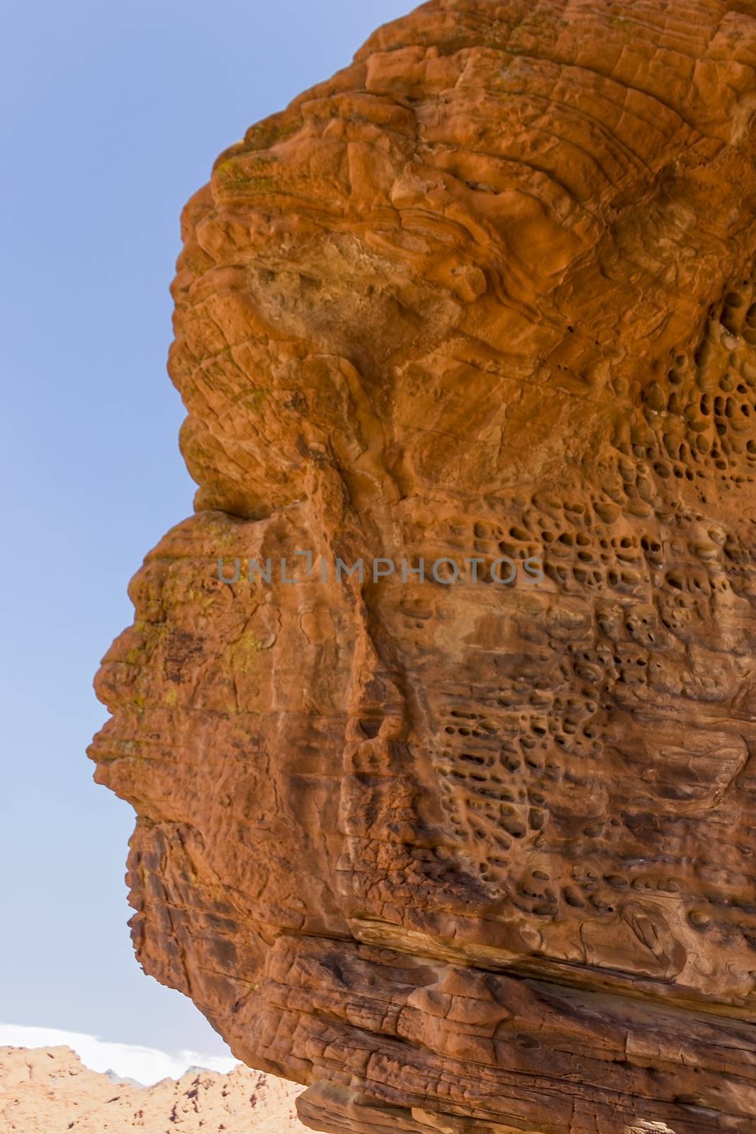 A profile shot of a rock formation that looks like a person whistling.