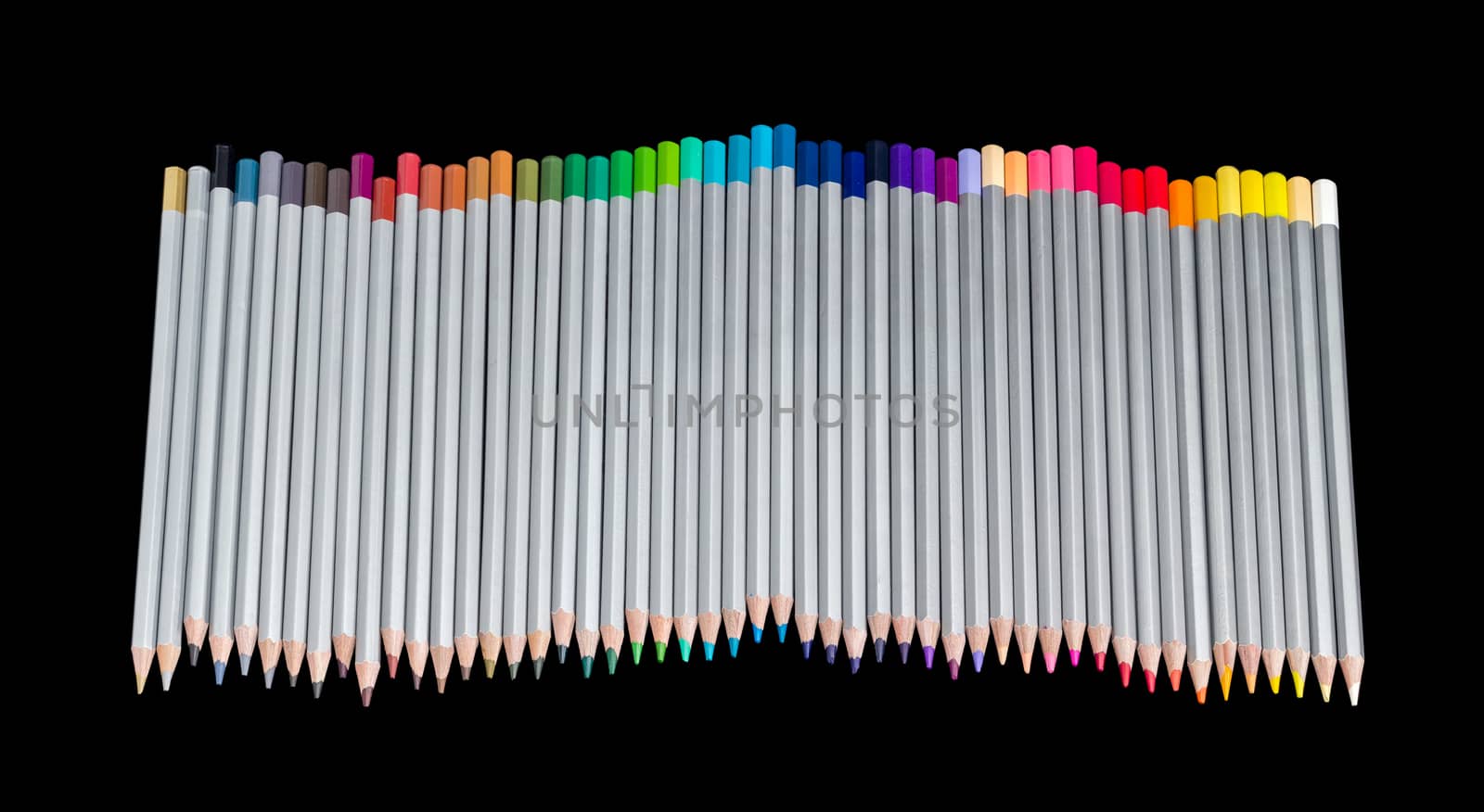 Set of colored pencils on a dark background by anmbph