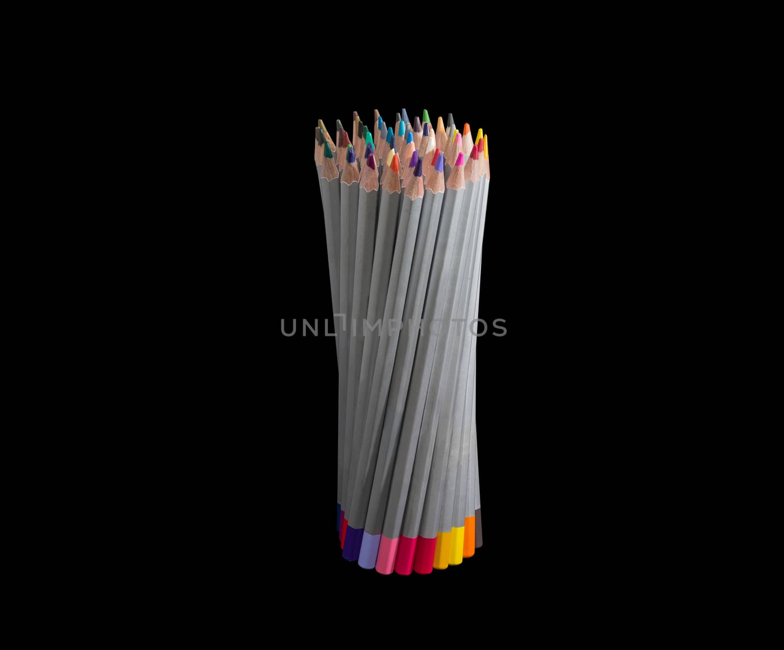 Bunch of colored pencils in gray wooden case on a dark background
