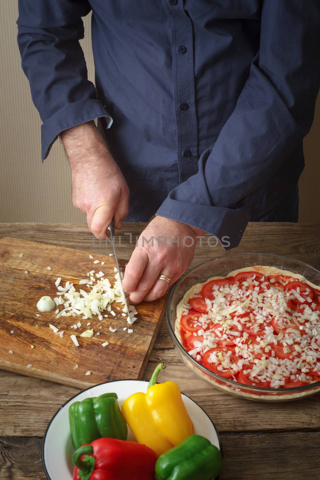 Sliced onion pizza on a cutting board by Deniskarpenkov