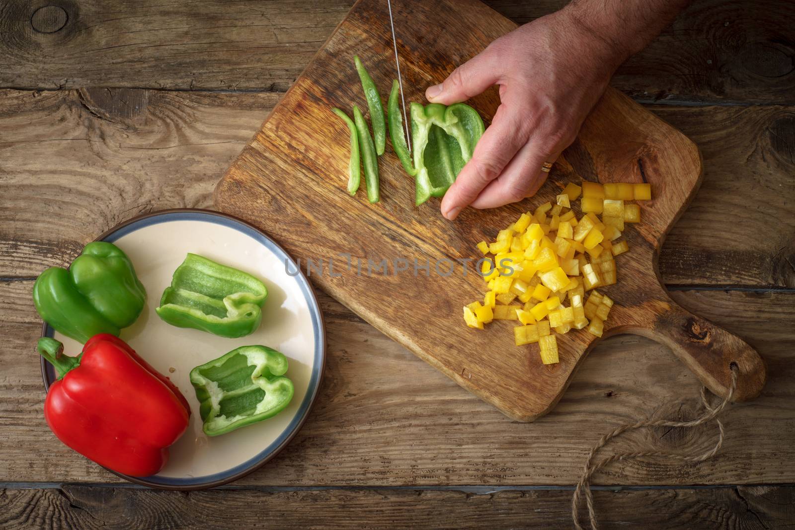 Sliced green pepper pizza on a cutting board by Deniskarpenkov