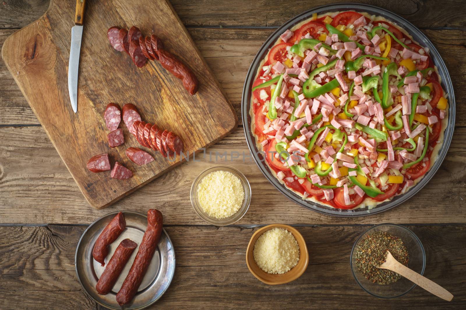Ham, pepper, onion, sausage on the pizza by Deniskarpenkov