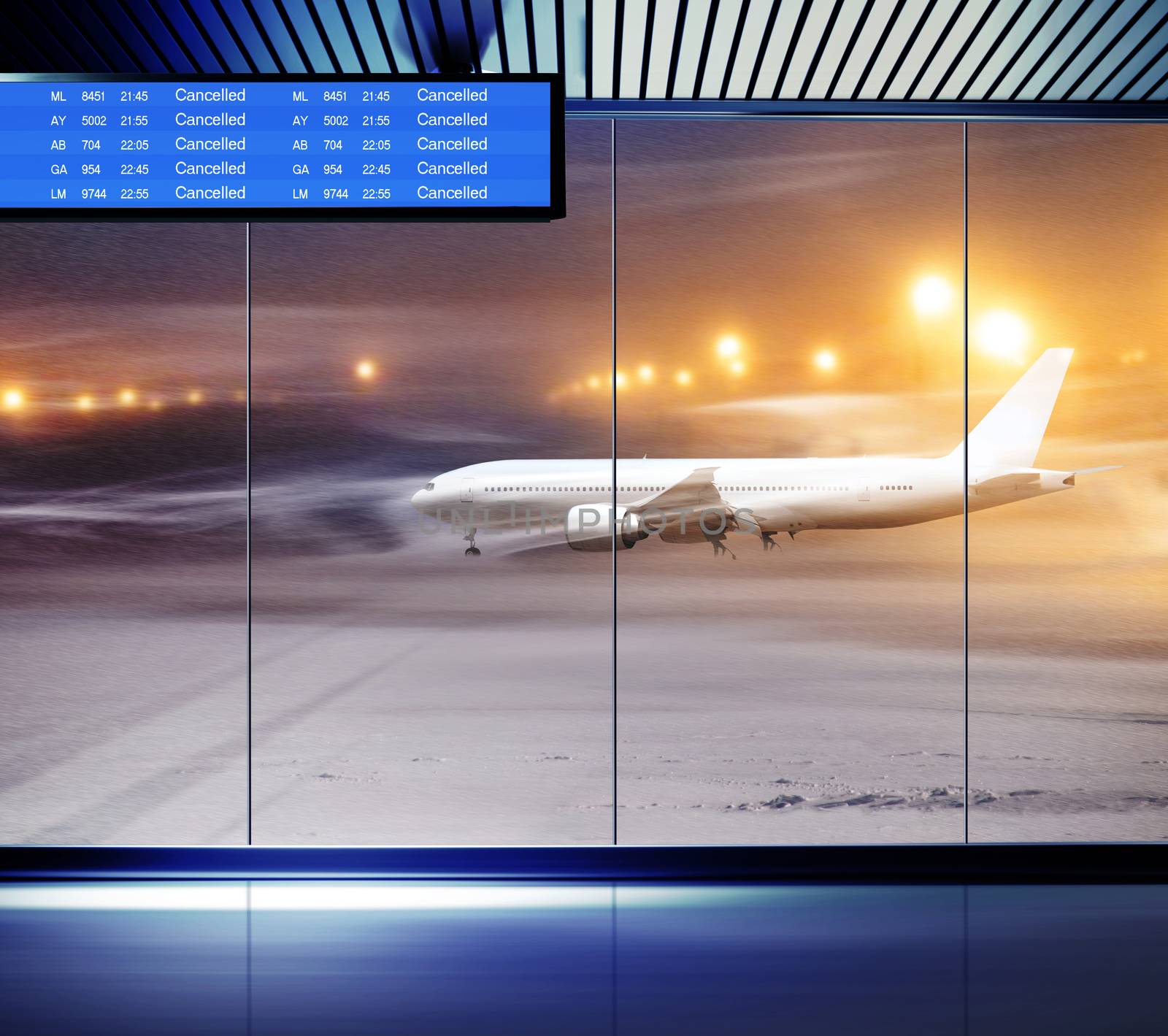 Non flying weather at airport, white plane in snowstorm