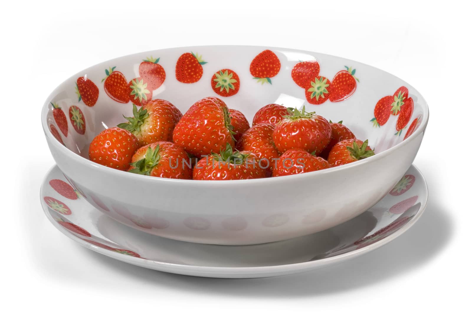Fresh ripe strawberries in a bowl isolated on white background