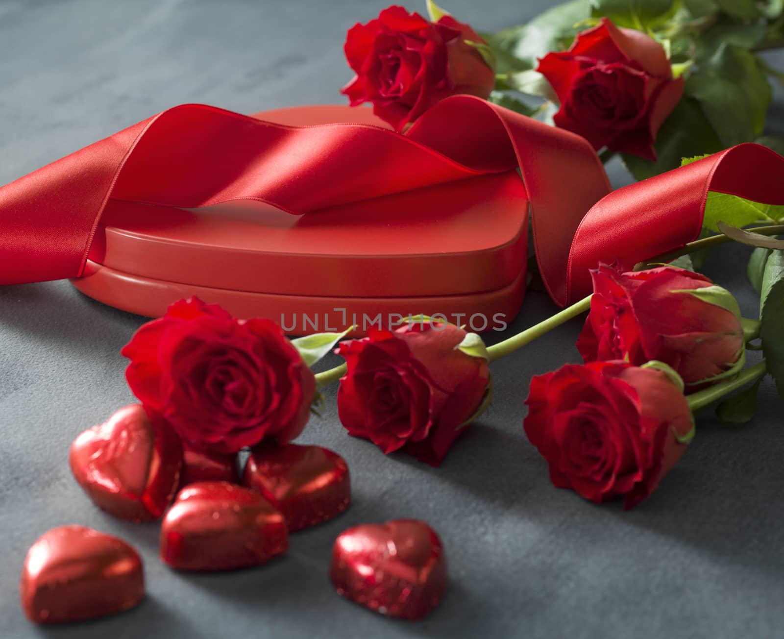 Heart shaped box with red hearts roses and ribbon. Valentines Day concept