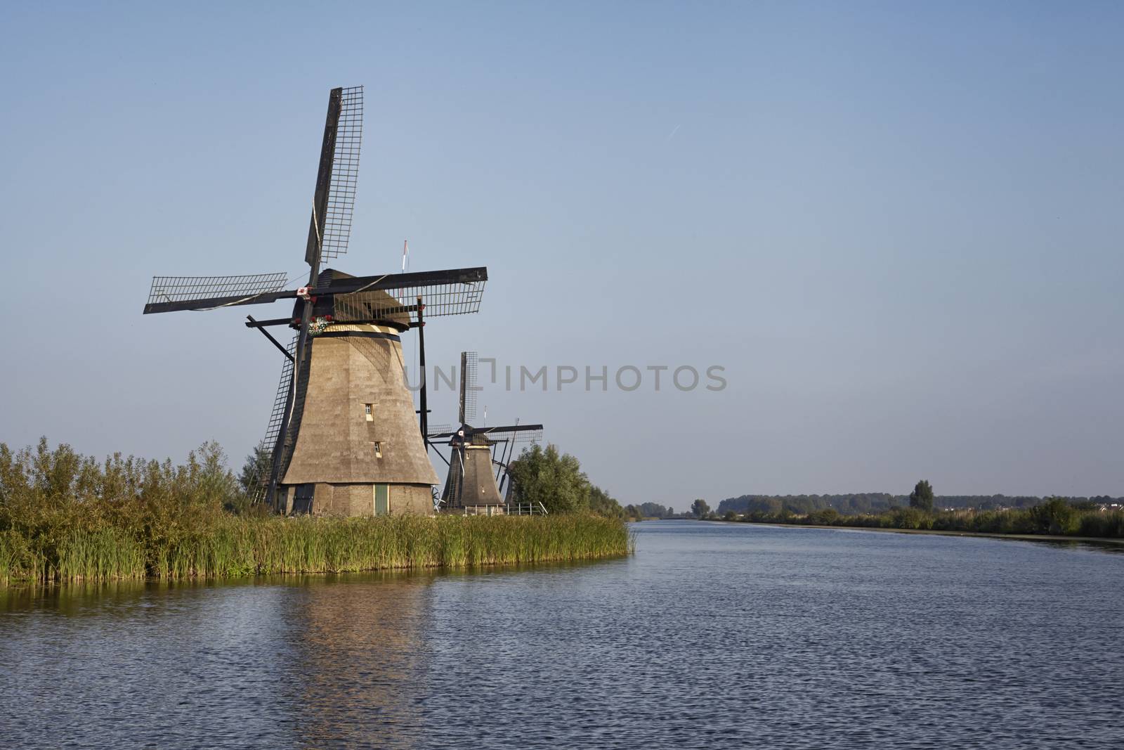 Several stone brick Dutch windmills at Kinderdijk, an UNESCO world heritage site