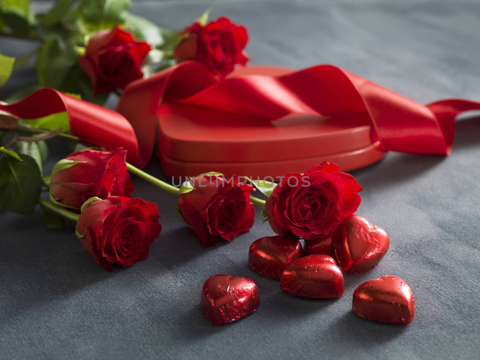 Red rose and box with red hearts. Valentines Day concept