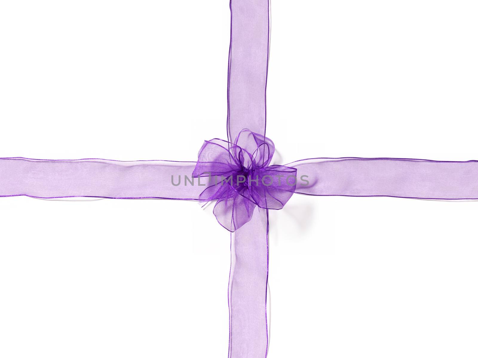 close up of a silk transparent ribbon knot on white background