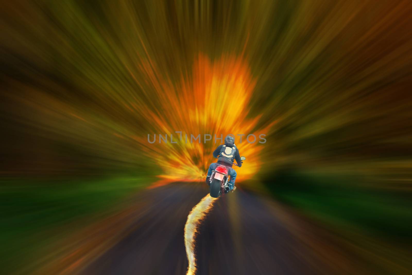 Motorcyclist with burning tire against a blurred abstract background.