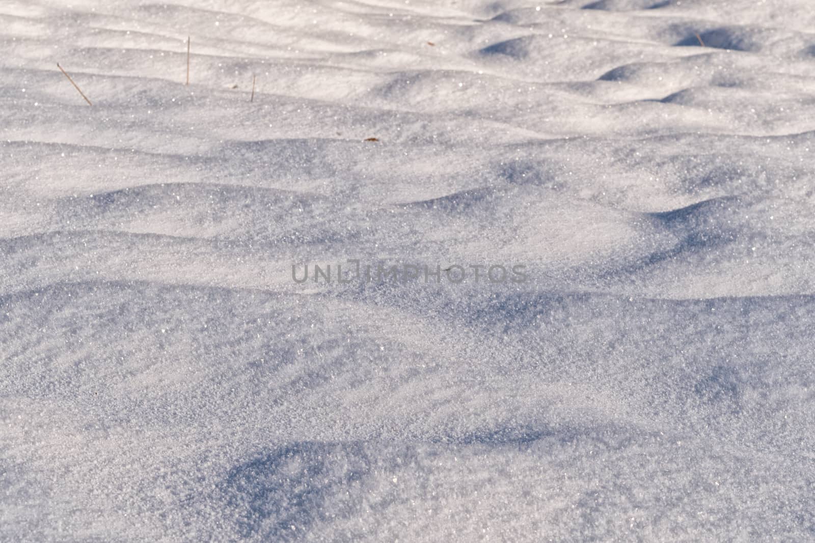 Background of fresh snow texture in warm tone