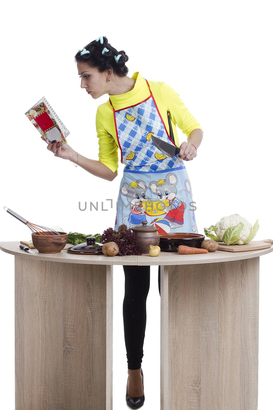 Woman cooking in kitchen by VIPDesignUSA