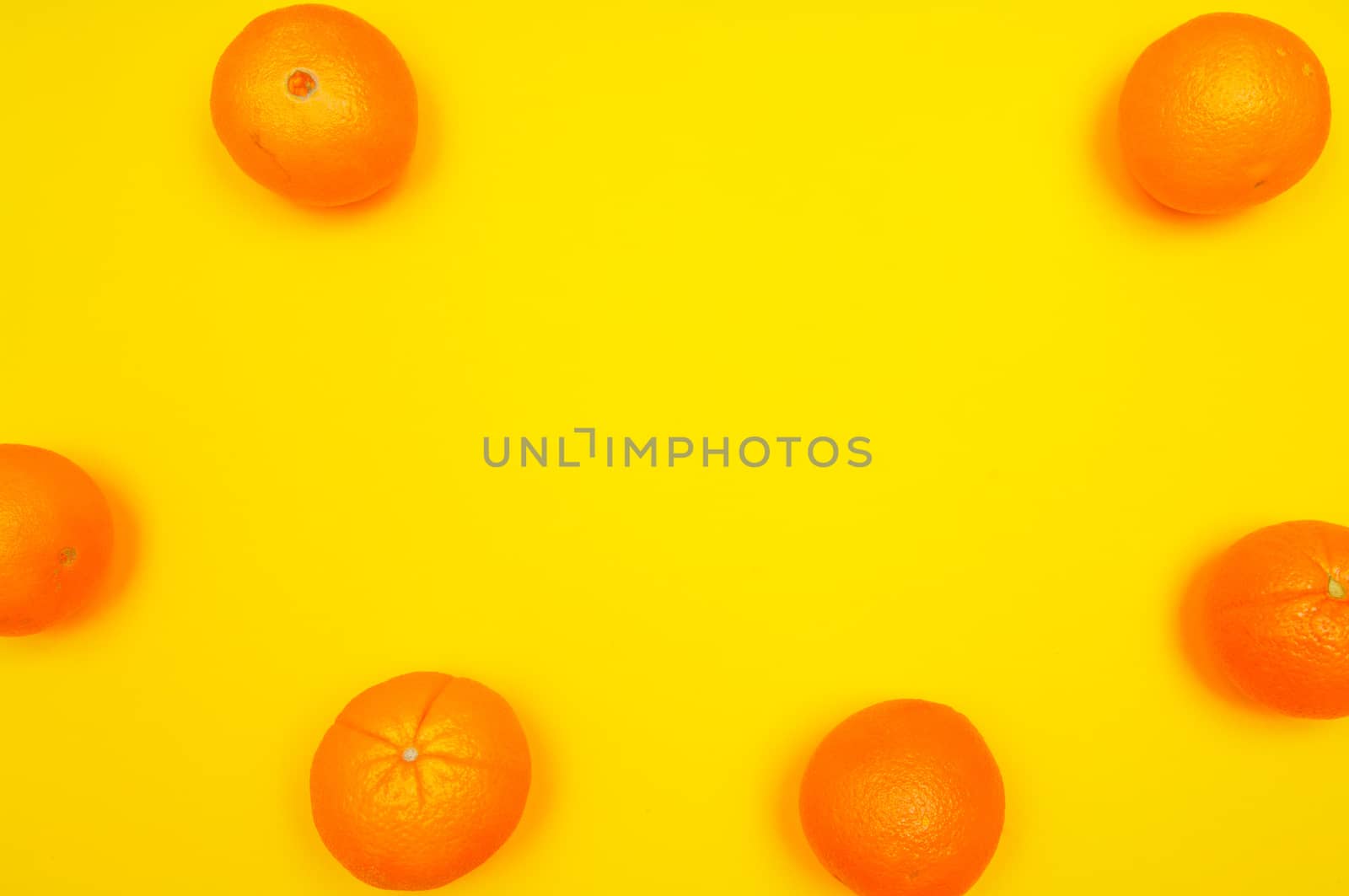 Orange pattern on orange colored background citrus arrangement